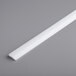 A white plastic strip for a Estella 78" reversible dough sheeter on a gray surface.