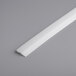 A white plastic strip on a gray surface with Estella replacement part number 348PDS94UBLD.