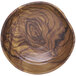 An Elite Global Solutions wood grain melamine bowl with a swirl pattern.