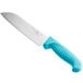 A Choice Santoku knife with a neon blue handle and granton edge.