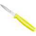 A Choice 3 1/4" serrated edge paring knife with a neon yellow handle.