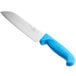 A Choice Santoku knife with a blue handle and Granton edge.