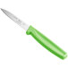 A Choice paring knife with a neon green handle.