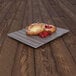 An Elite Global Solutions brown textured melamine platter with pastries and berries on it.