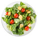 An Arc Cardinal glass dinner plate with a salad topped with tomatoes and croutons.
