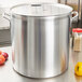 A large Vollrath aluminum pot with a lid on a counter.