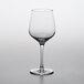 A close up of a Nude Refine white wine glass on a white surface.