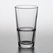 A close-up of a Pasabahce Grande stackable beverage glass.