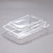 A Dart clear hinged PET plastic container with a shallow dome lid.