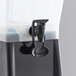 A black plastic Choice beverage dispenser with a handle.