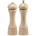 A close-up of a wooden Chef Specialties pepper mill and salt shaker with a metal top.