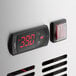 A digital thermostat with red numbers on a Cooking Performance Group Chef Base.