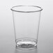 A EcoChoice clear plastic cold cup with a clear rim on a white surface.