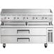 A large stainless steel Cooking Performance Group gas countertop griddle with manual controls and three drawers.