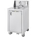 A Crown Verity stainless steel portable hands-free hand sink on wheels.