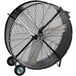 A large black TPI industrial drum fan with wheels.
