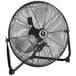 A close-up of a black TPI industrial floor fan with a metal basket.