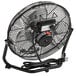 A TPI 12" industrial floor fan with a metal stand and black cord.