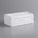 A stack of Monarch Brands white terry cloth towels.
