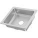 A Vollrath stainless steel drop-in sink bowl with a drain hole.