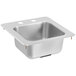 A stainless steel Vollrath sink bowl with two holes.