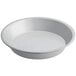 A white round pan with a white rim.