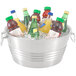 A Vollrath stainless steel beverage tub filled with ice and soda bottles.