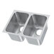 A silver Vollrath stainless steel undermount sink with two compartments and two holes.