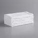 A stack of Monarch Brands white terry cloth rags.