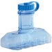 A clear plastic water bottle with a blue cap.