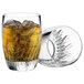 Two Luigi Bormioli Incanto rocks glasses filled with ice and drinks.