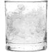 A glass with ice made by a Scotsman air cooled flake ice machine.