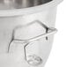 A Globe stainless steel mixing bowl with a handle on a counter.