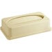 A beige rectangular trash can lid with an oval window.