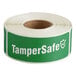 A roll of green and white TamperSafe labels with white text.
