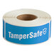 A roll of blue TamperSafe labels with white text.