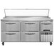 A stainless steel Continental Pizza Prep Table with four drawers and a half door.