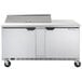 A Beverage-Air stainless steel refrigerated sandwich prep table with 2 doors on wheels.