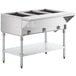 A large stainless steel ServIt liquid propane steam table with three wells on an undershelf.