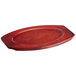 A red oval wooden underliner.