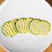 A plate of zucchini and yellow squash sliced with a Robot Coupe 5/64" ripple cut disc.