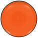 An orange RAK Porcelain deep porcelain plate with a black rim.