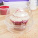 A InnoPak clear plastic container with a cupcake inside.