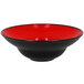 A red porcelain plate with a wide black rim.