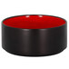 A black bowl with a red rim and a red interior.