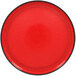 A red RAK Porcelain rimless plate with a black rim.