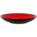 A red and black RAK Porcelain deep coupe plate.