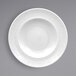 A RAK Porcelain white porcelain plate with an embossed white rim.