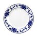 A white Thunder Group round melamine plate with blue flowers and a blue and white design.