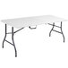 A white rectangular Bridgeport Essentials folding table with a steel frame.